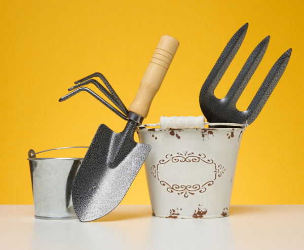 2400-miniature-garden-tools-in-a-metal-bucket-on-a-yellow-background-1