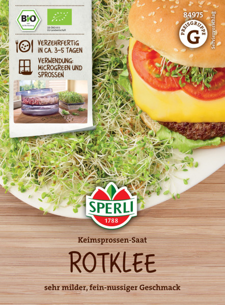 Produktbild von Sperli BIO Keimsprossen-Saat Rotklee mit Angaben zu Bio-Qualität, Verzehrreife und Verwendung, sowie Preisgruppenhinweis und Darstellung eines Hamburgers mit Sprossen garniert.