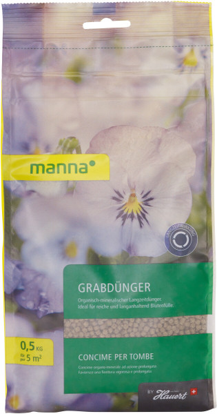 Produktbild von MANNA Grabdünger 500g Verpackung mit Natur und Blumenmotiv sowie Produktinformationen und Markenlogo auf Deutsch und Italienisch.
