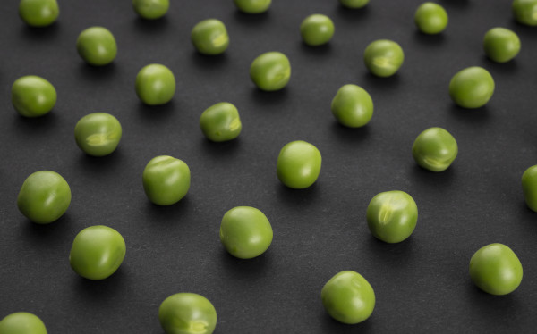 large-pattern-of-green-peas-on-black-background