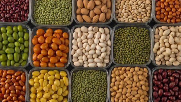 large-colorful-assortment-of-legumes-and-nuts-in-transparent-containers