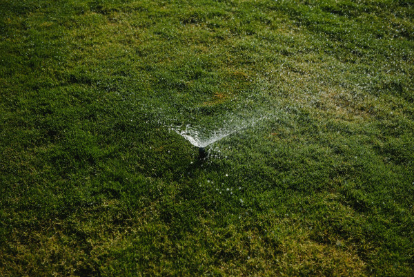 2400-modern-device-of-irrigation-garden-irrigation-system-technique-of-watering-in-the-garden-lawn-sprinkler-spraying-water-over-green-grass
