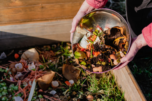 2400-person-who-put-in-a-composter-some-kitchen-waste-like-vegetables-fruits-eggshell-coffee-grounds-in-order-to-sort-and-make-bio-fertilizer