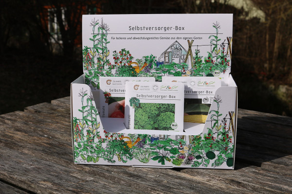 Produktbild der Culinaris BIO Selbstversorger-Box mit verschiedenen Saatgut-Tueten fuer Gemuese auf einem Holztisch mit gartenmotivierter Illustration und BIO-Siegel