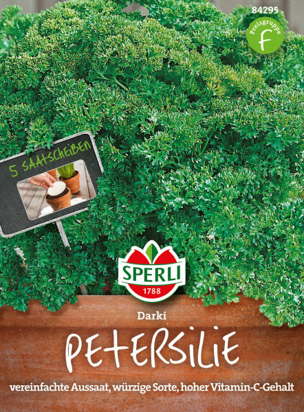 Produktbild von Sperli Petersilie Darki Saatscheibe mit Darstellung üppiger Petersilienpflanzen und Verpackungshinweisen auf vereinfachte Aussaat und hohen Vitamin-C-Gehalt.