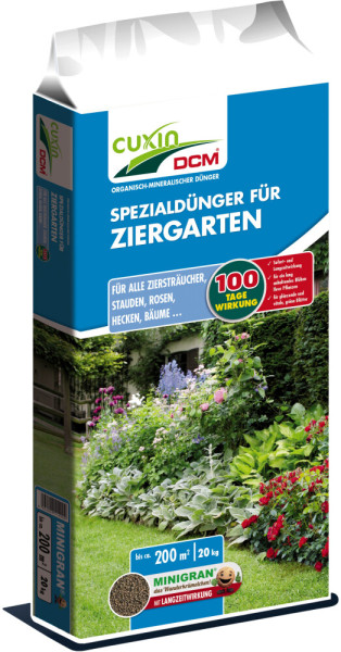 Produktbild von Cuxin DCM Spezialdünger für Ziergarten Minigran in einer 20kg Packung mit Angaben zur Anwendung und Wirkungsdauer, dargestellt neben einer blühenden Gartenlandschaft.
