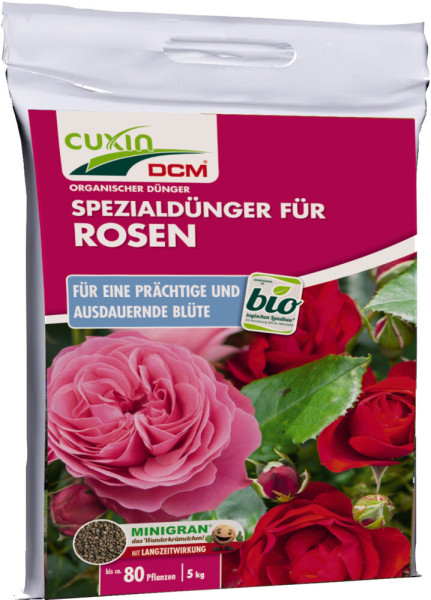 Produktbild von Cuxin DCM Spezialduenger fuer Rosen und Blumen Minigran 5kg mit Abbildung von roten und pinken Rosen sowie Hinweise auf Bioqualitaet und Langzeitwirkung.