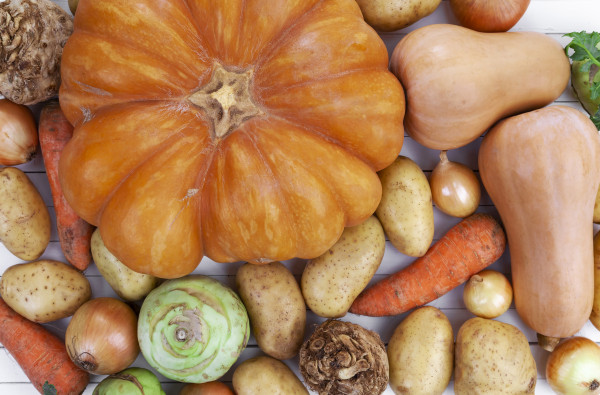 large-autumn-vegetables-on-white-wooden-table-background-top-view