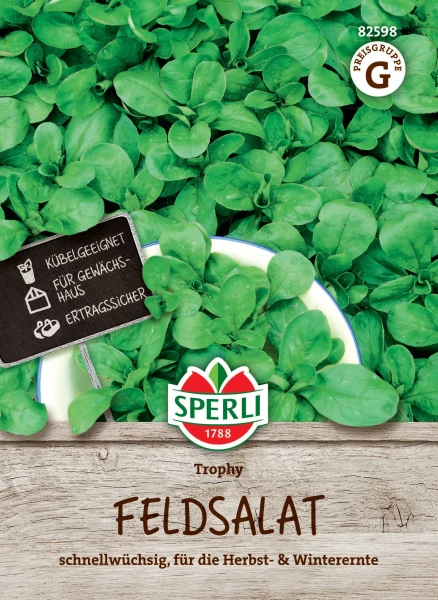 Produktbild von Sperli Feldsalat Trophy mit grünen Feldsalatblättern und Verpackungsdetails wie Klassifikation für die Herbst- und Winterernte in deutscher Sprache.
